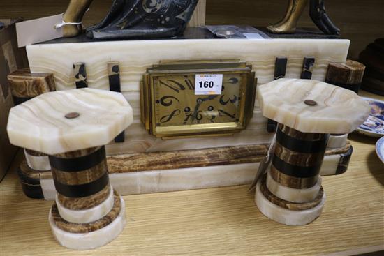 A French Art Deco marble and alabaster clock garniture with figural surmount width 58cm height 51cm